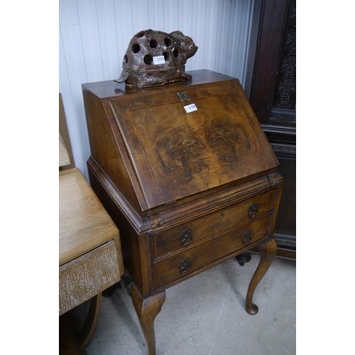 2158 - A small 1930's walnut two drawer bureau