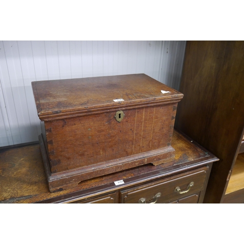 2162 - A small 19th Century oak box, the lift lid opening to reveal candlebox interior, plinth base