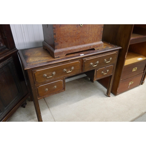 2163 - An Edwardian mahogany four drawer desk