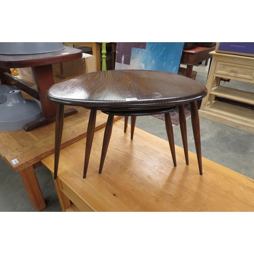 2432 - A dark Ercol nest of 3 pebble tables