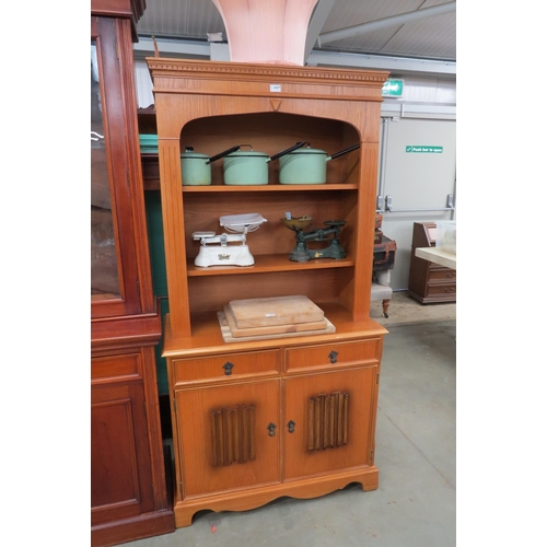 2437 - A light oak bookcase on cupboard