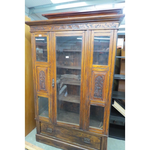 2439 - An early 20th Century oak wardrobe converted into a bookcase