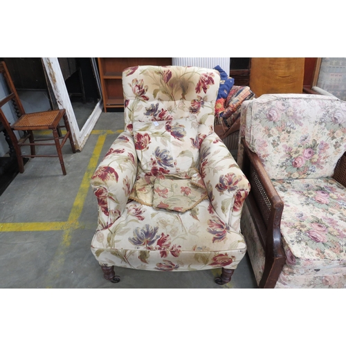 2444 - An Edwardian armchair and cushion upholstered in tulip fabric