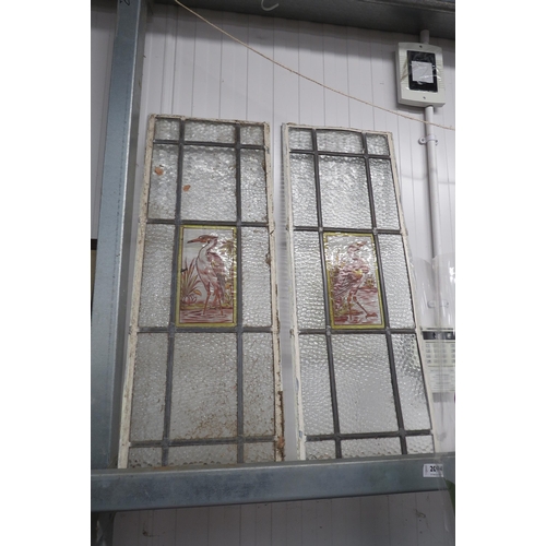 2094 - A pair of leaded stained glass panels over painted with heron (one a/f)    (R) £40