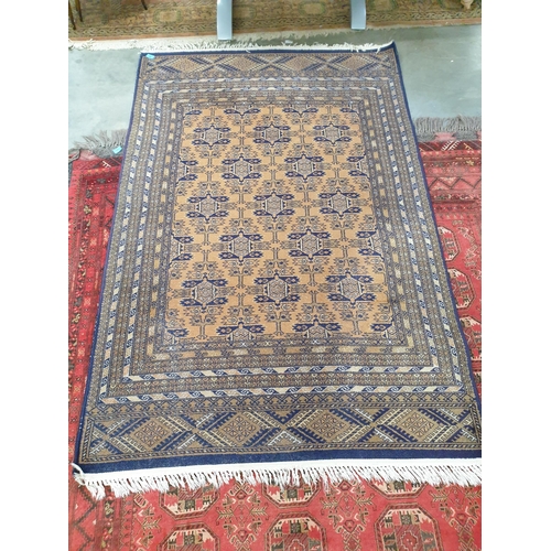 2447 - A blue and yellow pattern wool rug, 132cm x 200cm   (R)  £10-20