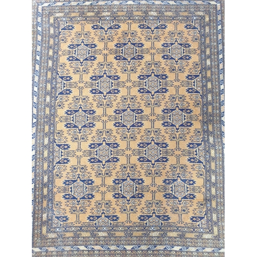 2447 - A blue and yellow pattern wool rug, 132cm x 200cm   (R)  £10-20