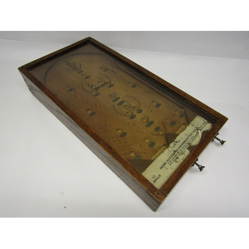 8334 - An Abtex Home Automatic Amusement Pin Table, in oak casing with glazed top