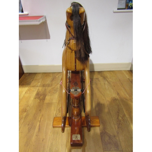 8270 - An Ian Armstrong handmade carved wooden rocking horse on trestle rocker with horsehair mane and tail... 