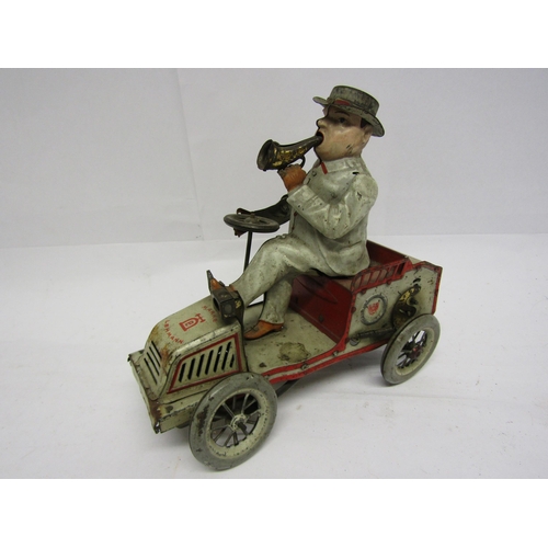 8239 - An early 20th Century Lehmann (Germany) Tut Tut white and red tinplate motor car with gentleman driv... 