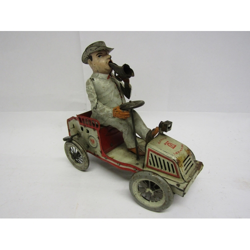 8239 - An early 20th Century Lehmann (Germany) Tut Tut white and red tinplate motor car with gentleman driv... 