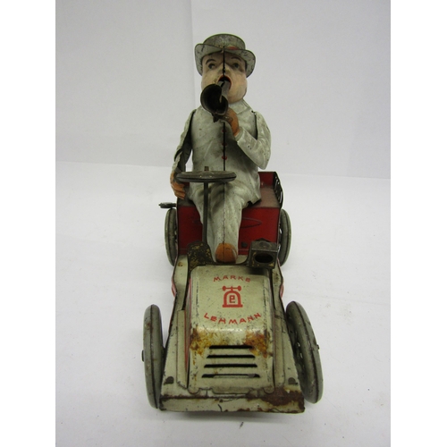 8239 - An early 20th Century Lehmann (Germany) Tut Tut white and red tinplate motor car with gentleman driv... 