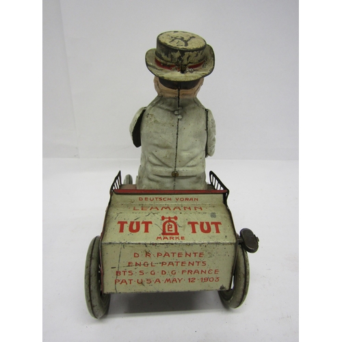 8239 - An early 20th Century Lehmann (Germany) Tut Tut white and red tinplate motor car with gentleman driv... 