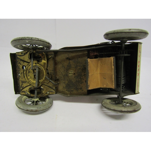 8239 - An early 20th Century Lehmann (Germany) Tut Tut white and red tinplate motor car with gentleman driv... 