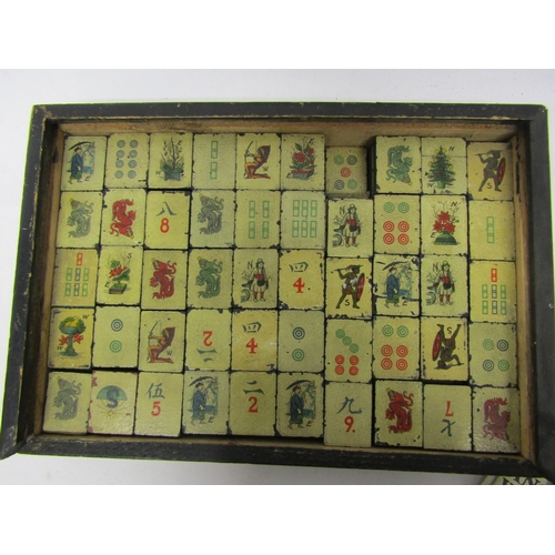 8335 - An early 20th Century Mah-Jongg set, housed in wooden wooden box with applied pictorial paper label