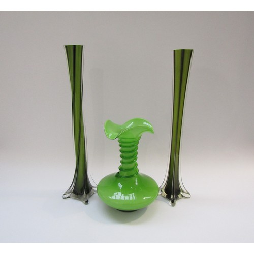 9181 - A Czech green glass vase with flared rim and applied spiral, 23cm high, plus two Italian tall stem v... 