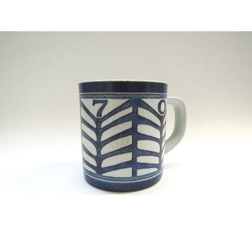 9127 - A Royal Copenhagen 1970 faience year mug designed by Dorte Schierup with 9255 silver roundel embedde... 