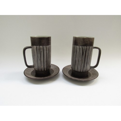 9128 - A pair of Einer Hellevoe BR keramik chocolate cups and saucers with vertical line detail. Cups 16cm ... 