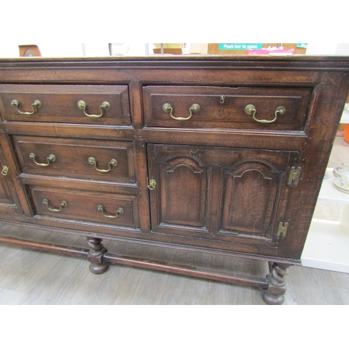 1057 - A Muirhead Moffat & Co., Glasgow, Georgian style oak sideboard with three central drawers flanked by... 