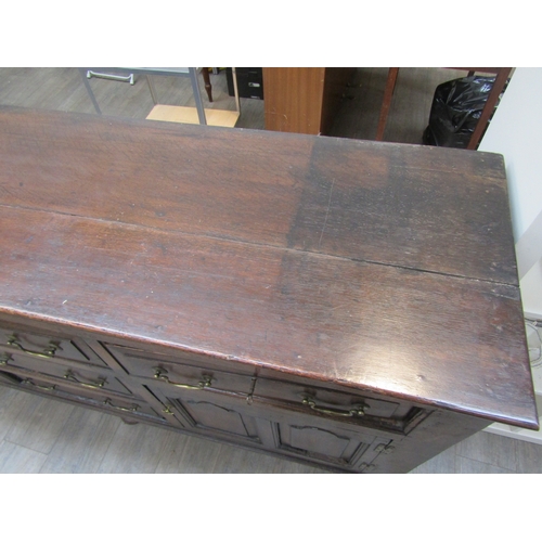 1057 - A Muirhead Moffat & Co., Glasgow, Georgian style oak sideboard with three central drawers flanked by... 