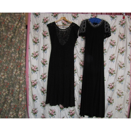 1063 - A black lace over dress (no slip) and a full length crepe evening dress which is cut on the bias wit... 