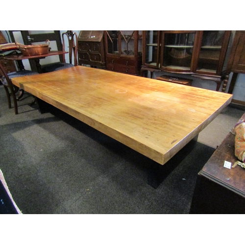 1154 - A hardwood coffee table on black painted base, 48cm tall x 214cm long x 96cm wide