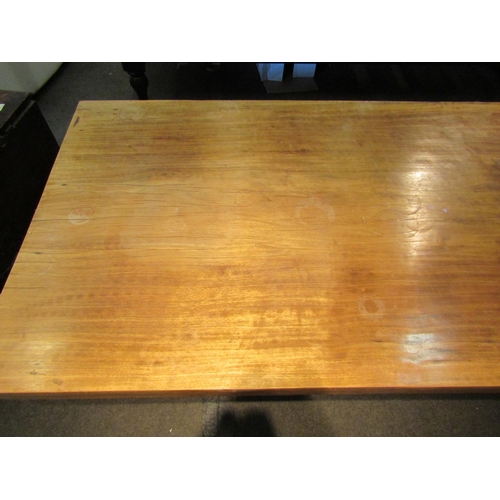 1154 - A hardwood coffee table on black painted base, 48cm tall x 214cm long x 96cm wide