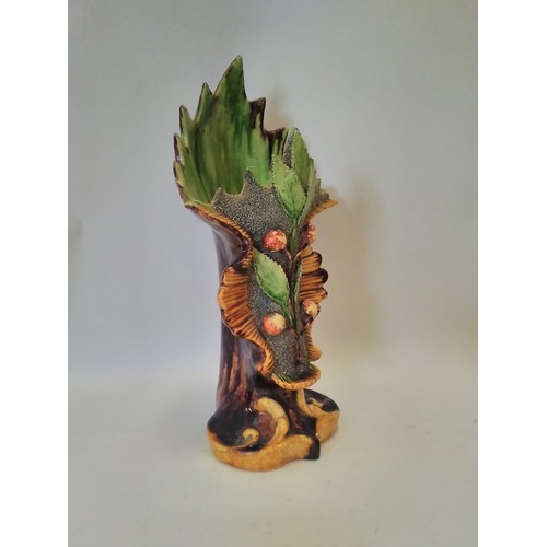 1295 - An A.J.F. Caldas majolica vase, laurel leaf and berry design with scrolled relief base, 32.5cm high,... 