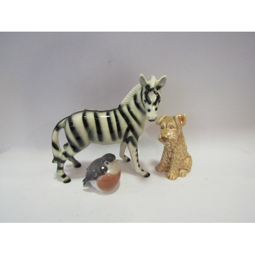 1297 - A Royal Copenhagen figure of a robin, Sylvac terrier dog and a Goldscheider style zebra