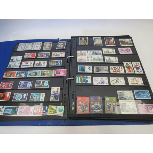 1387 - An album of mixed UK stamps and a folder containing mint stamps, approx. £182 in face value