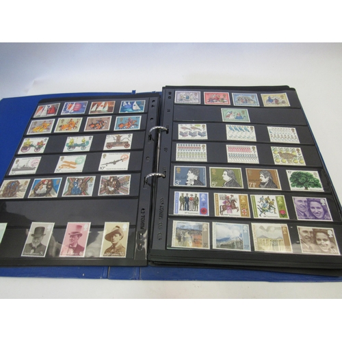 1387 - An album of mixed UK stamps and a folder containing mint stamps, approx. £182 in face value