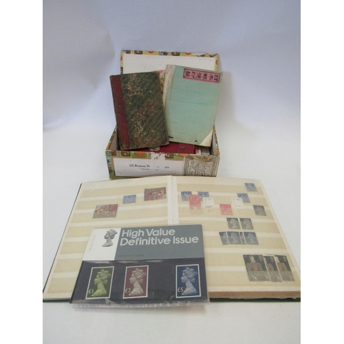 1388 - A cigar box containing stamp collectors' stamp books, a high value definitive pack, etc