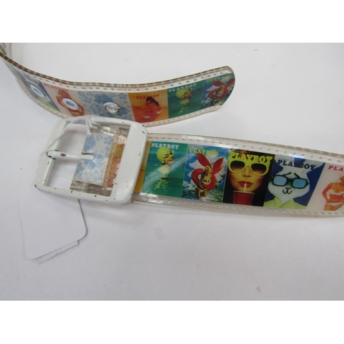 1378 - A plastic reproduction playboy belt with a white metal buckle, the belt depicting playboy covers, bu... 