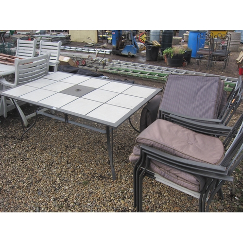 3423 - A tiled top alloy table with six chairs