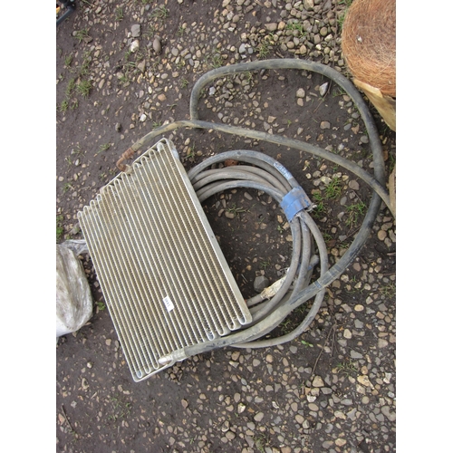 3440 - An alloy radiator and a coil of armoured cable