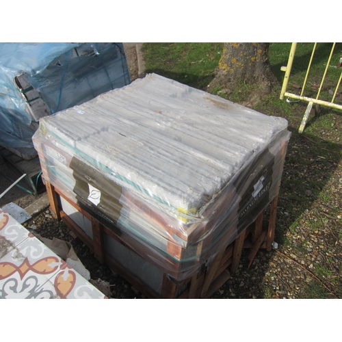 3660 - A pallet of unused sandstone slabs