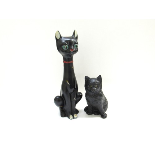 9114 - A large mid-century tall kitsch black cat pottery figurine and a Bretby Pottery black cat with glass... 