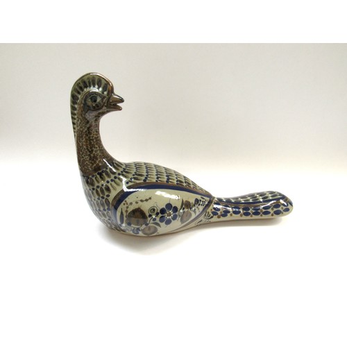 9095 - A studio ceramic figure of a Pheasant with painted detail, painted indistinct signature      40cm lo... 