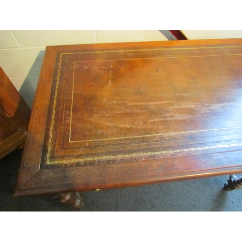 1008 - An early 20th Century desk, the tooled leather top over two frieze drawers, turned supports joined b... 