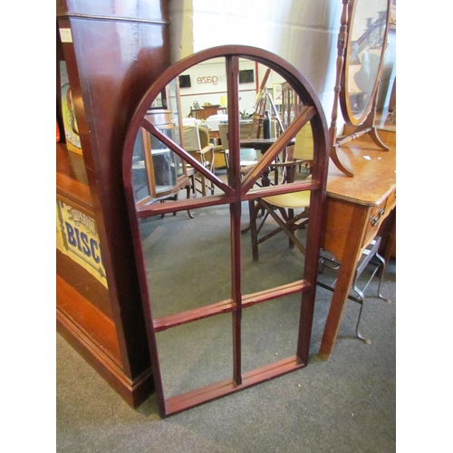 1024 - A wooden framed arch top sectional mirror, 110cm tall x 57cm wide