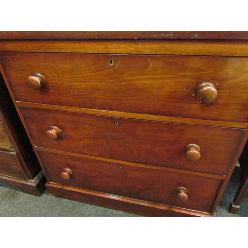 1042 - A Victorian mahogany chest of three long drawers, bun handles, loss to veneer, 87cm tall x 89cm wide... 