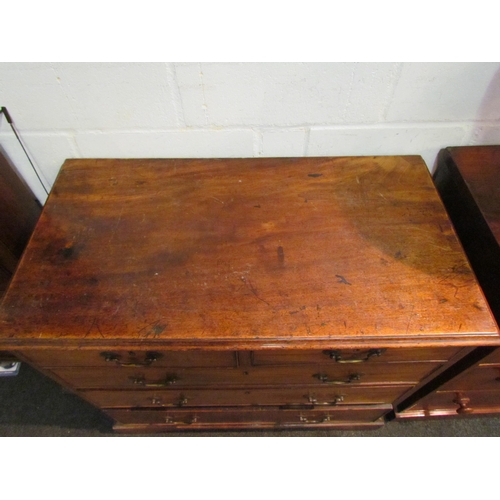 1046 - A George III mahogany chest of two short over three long drawers, swan neck handles, bracket feet, 8... 