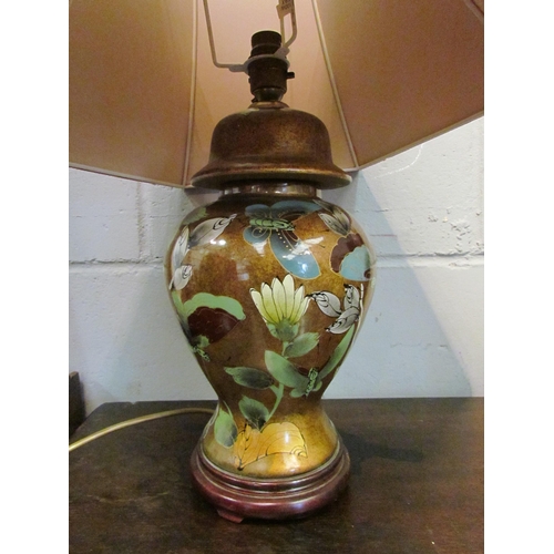 1055 - A decorative lustre ceramic table lamp with butterfly detail, 64cm tall with shade