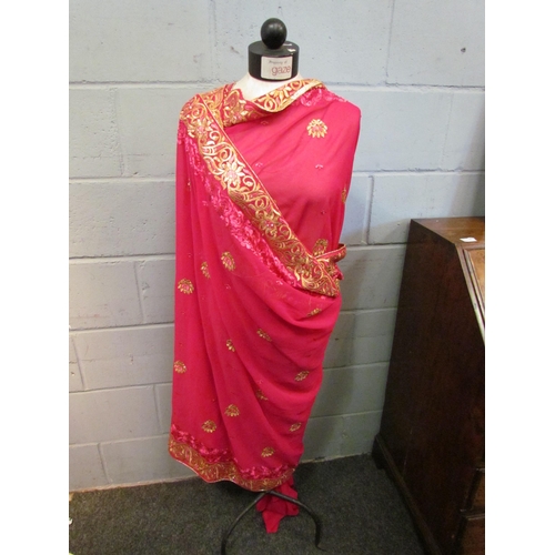 1064 - Three sari textiles in vibrant pinks, gold and green, two bearing original retail labels