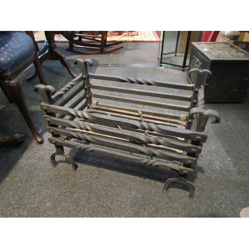 1074 - A wrought iron blacksmith-made fire basket, 40cm tall x 61cm wide x 29cm deep