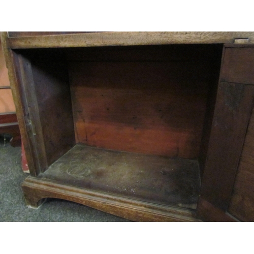 1093 - A Regency style mahogany bookcase, the base set with drawers, 92cm tall x 84cm wide x 21cm deep