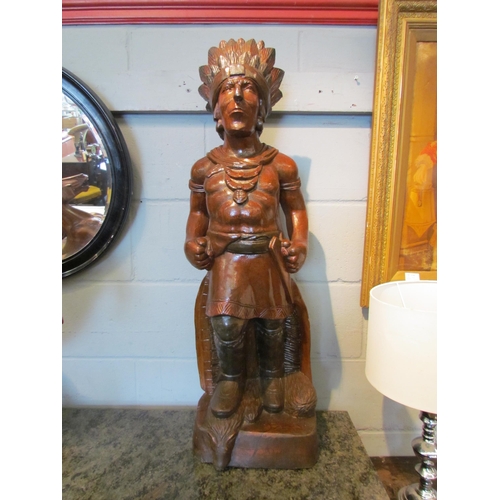 1103 - A large carved wooden figure of a Native American, 96cm tall