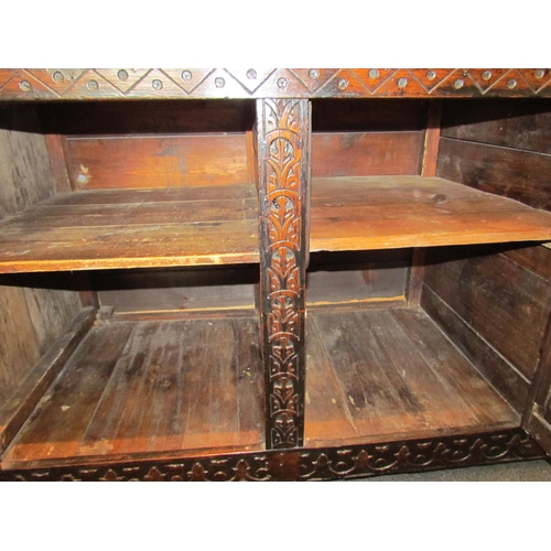 1107 - A Victorian carved oak dresser base with later marble top over three drawers and three door cupboard... 