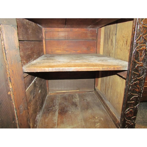 1107 - A Victorian carved oak dresser base with later marble top over three drawers and three door cupboard... 