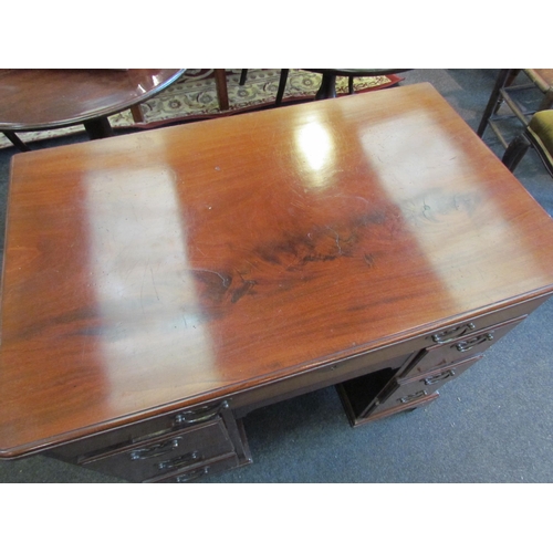 1127 - A Victorian mahogany kneehole desk, single drawer over cupboard door flanked by drawers, 76cm tall x... 