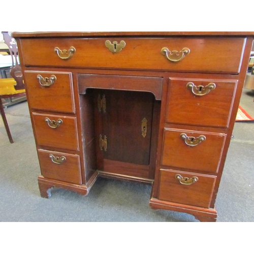 1127 - A Victorian mahogany kneehole desk, single drawer over cupboard door flanked by drawers, 76cm tall x... 